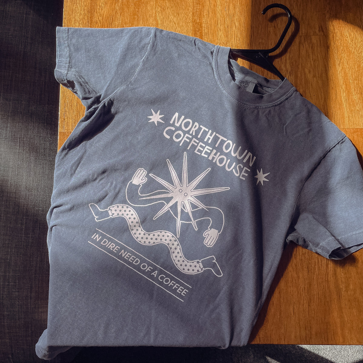In Dire Need of - T-Shirt